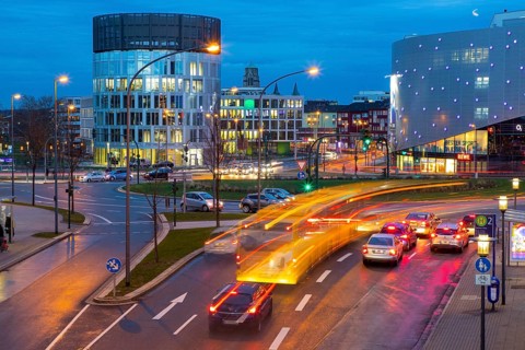 Evening city traffic in Essen, Germany, large intersection, roundabout, Berliner Platz, Berlin