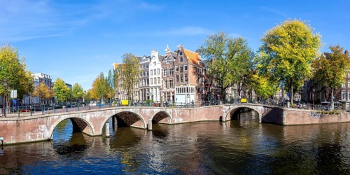 Canals and bridges building panorama at the Keizersgracht in the city of Amsterdam, Netherlands