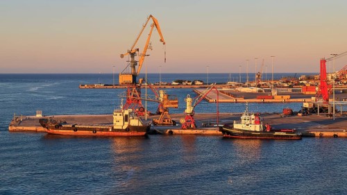 Evening light, pier, loading cranes, tugboats, port, Heraklion, capital, island of Crete, Greece,