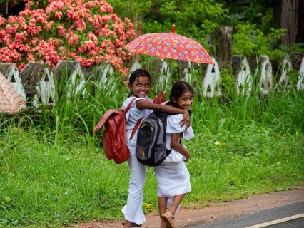 School children, girls in white school clothes with umbrella, Dambulla, Sri Lanka, Asia