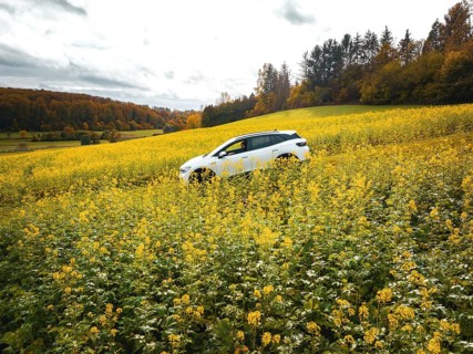 Volkswagen ID4 electric car in a rape field, Black Forest, Gechingen, Germany, Europe