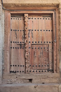 Old wooden door in Mutrah Fort, Muscat, Oman, Asia