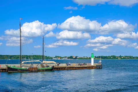 The two-masted sailing ship ALFRED at the northern pier in the harbour of the Hanseatic city of