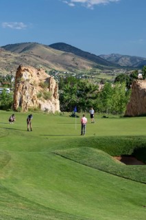 Golden, Colorado, The Fossil Trace Golf Course. Golfers play near footprints of dinosaurs and