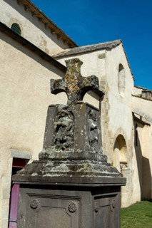Artonne. Cross stone in front of Saint Martin church. Puy de Dome department. Auvergne Rhone Alpes.