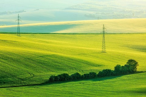 Moravian summer rolling landcsape with two power line tower. Moravia, Czech Republic, Europe