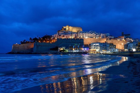 Old town with the Romanesque castle from the 14th century, blue hour, Peñíscola, province