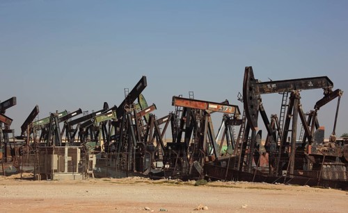 Storage with disused oil pumps near Marmul, Oman, Asia