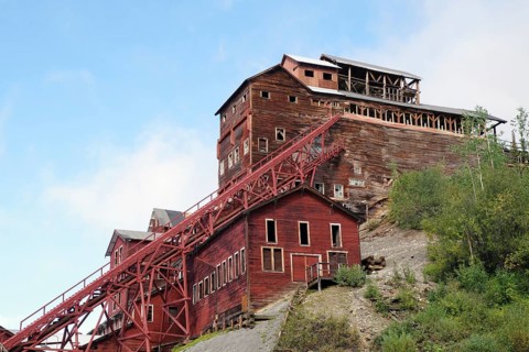 Old industrial ruins on the hillside, copper mining, red wooden buildings, ghost town, Unesco World