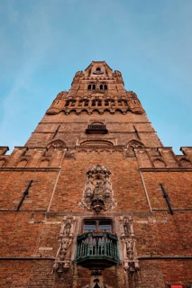 Brugge Belfry tower facade of famous tourist destination at Grote markt square in Bruges, Belgium