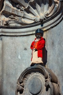 Brussels, Belgium, May 29, 2018: Famous tourist attraction of Brussels, dressed Manneken Pis statue