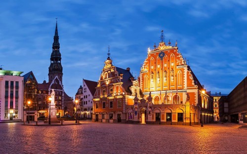 Panorama of Riga Town Hall Square with House of the Blackheads, St. Roland Statue and St. Peter's