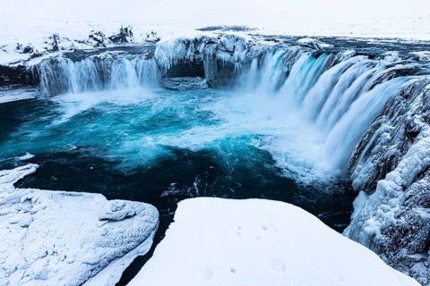 Godafoss waterfall, icy and snowy rock face, Northern Iceland Eyestra, Iceland, Europe