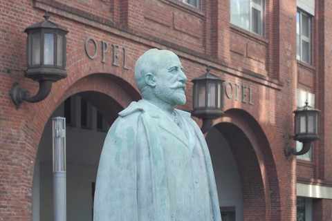 Monument and statue to Adam Opel 1837-1895 with inscription, personality, main portal, Rüsselsheim,