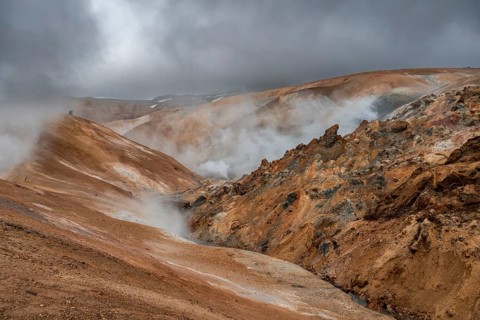 Steaming stream between colourful rhyolite mountains, Hveradalir geothermal area, Kerlingarfjöll,