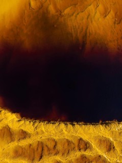 Detail of the Rio Tinto (Red river) with its deep reddish hue due to oxidised iron minerals in its