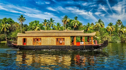 Travel tourism Kerala background, panorama of tourist houseboat on Kerala backwaters. Kerala,