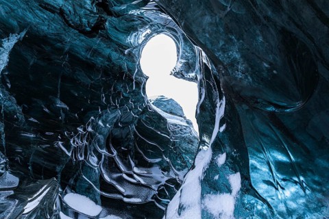 Ice cave open to the top with snow-covered ice combs, Pröng ice cave, Sudurland, Iceland, Europe