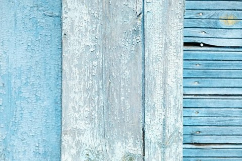 Abstract wooden background. Cracked paint on the wall