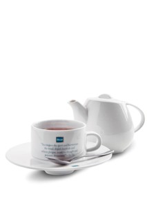 July 25, 2019, Minsk, Belarus, Ceramic tea cup and pot with Dilmah tea isolated on white, Europe