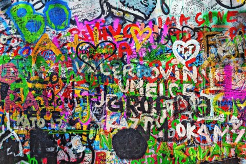 PRAGUE, CZECH REPUBLIC, APRIL 28, 2012: Lennon Wall is filled with John Lennon-inspired graffiti
