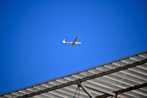 ASK 2 two-seater, D-6448, flies over stadium roof, sky, blue, PreZero Arena, Sinsheim,