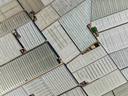 Masses of shimmering plastic greenhouses near El Ejido, aerial view, drone shot, Almería province,