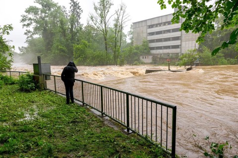 Symbolic image extreme weather, global warming, climate change, flood, flooded weir in Remseck an