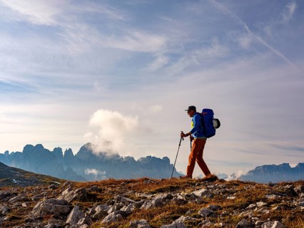 Mountaineer on the Dolomites High Route 8, behind rose garden, Schlern, Dolomites, South Tyrol,