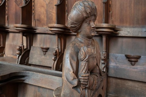 Figure on the late Gothic choir stalls from 1507, St Martin, Memmingen, Bavaria, Germany, Europe
