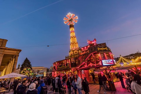 Stuttgart Christmas market at the blue hour. Christmas pyramid on the Schlossplatz in front of the