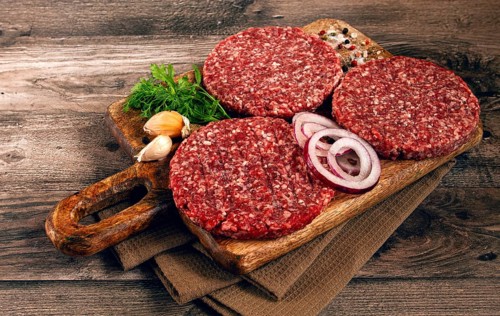 Raw cutlets, for burgers, minced meat, handmade, homemade, with spices, top view, no people