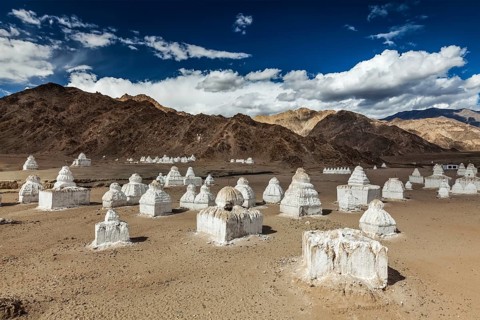 Whitewashed chortens (Tibetan Buddhist stupas) . Nubra valley, Ladakh, India, Asia