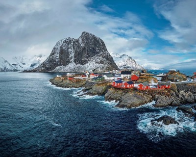 Hamnoy fishing village with red rorbu houses in Norwegian fjord in winter. Lofoten Islands, Norway,