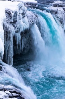 Godafoss waterfall, icy and snowy rock face, Northern Iceland Eyestra, Iceland, Europe
