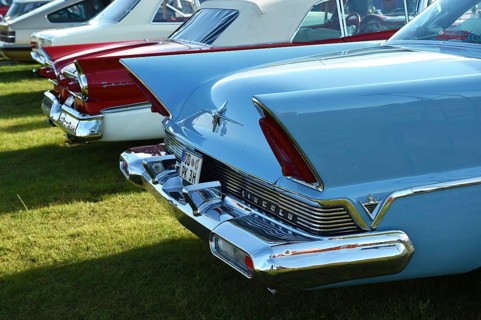 Rear view, Lincoln Premiere, and Ford Fairlane 500, Skyliner, at a classic car meeting in Büsum,