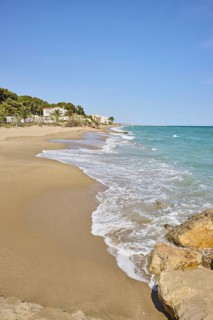 Breaking waves on a sandy beach, sunny, near Tarragona, Catalonia, Spain, Europe