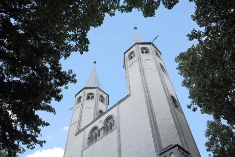 Towers of the Romanesque Neuwerk Church with perspective and view upwards, Goslar, Harz, Lower