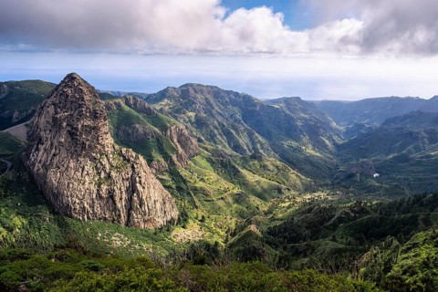 View of the Roque de Agando rock tower from the Mirador del Morro de Agando. To the right is the