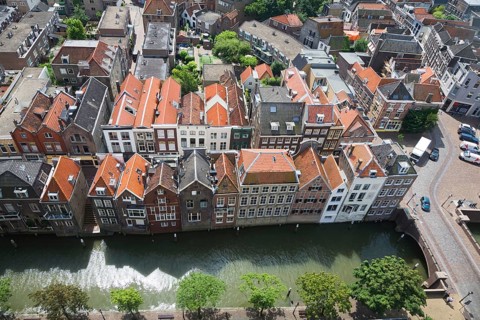 Raised oblique aerial view over historic rooftops in the city centre, Dordrecht, Netherlands