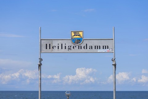 Welcome sign with coat of arms of Bad Doberan and Heiligendamm at the pier, Mecklenburg-Vorpommern,