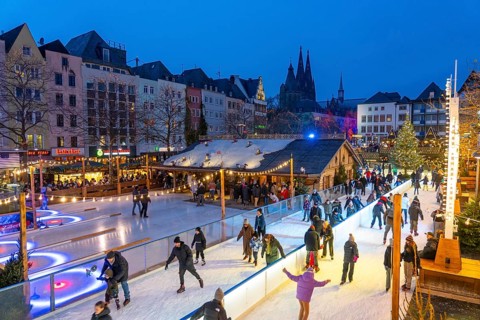 Ice rink at the Christmas market on the Heumarkt in the old town of Cologne, Cologne Cathedral,