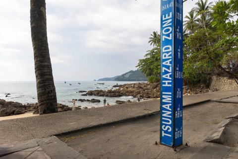Tsunami Hazard Zone. Warning sign, signposting of escape routes in the event of another seaquake.