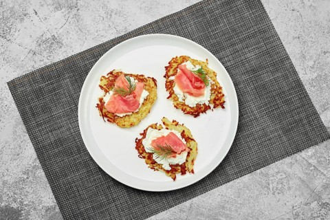 Top view of potato flapjack with salmon and cream cheese