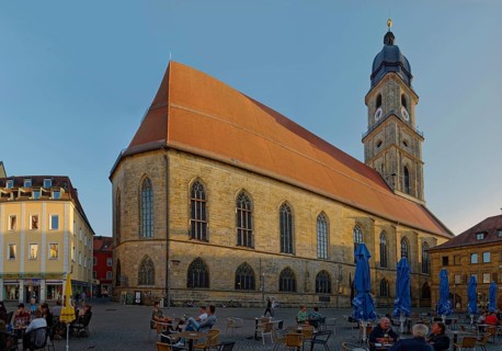Lively market square with cafés and St Martin's Basilica in the evening light, Amberg, Upper