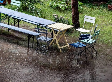 Flooded garden with tables and chairs, Berlin, 23 06 2023
