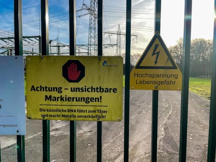Sign with warning for metal thieves against theft of metal Metal theft on fence gate gate access of