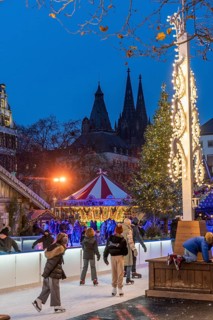 Ice rink at the Christmas market on the Heumarkt in the old town of Cologne, Cologne Cathedral,