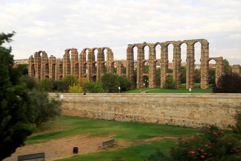 Blurred motion shot from speeding train of Roman aqueduct, Acueducto de Los Milagros, Merida,