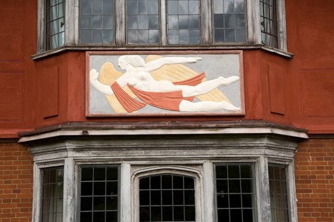 Pargeting plasterwork figure of a flying angel, Wyken Hall, Suffolk, England, UK